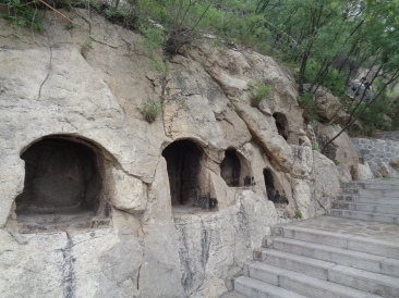 Niches for idols carved into the mountainside.