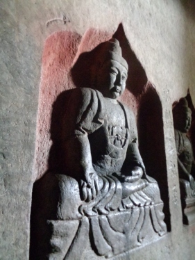 Bodhisattvas in their cavern nooks.